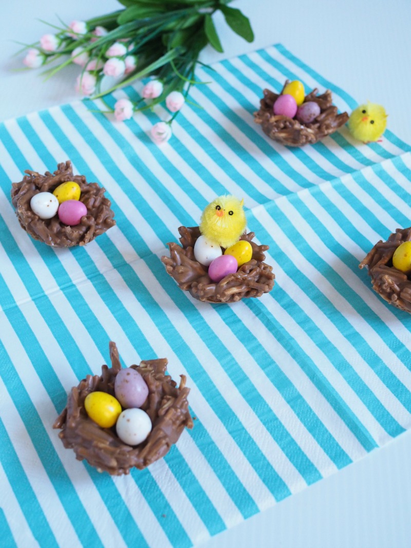 chocolate easter nests made from fried noodles and topped with mini chocolate eggs and chickens